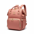 Baby diaper bag backpack in salmon pink on white background